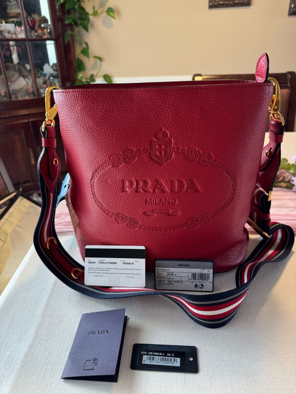 Prada Red Pebbled Leather Bucket Bag with Striped Strap